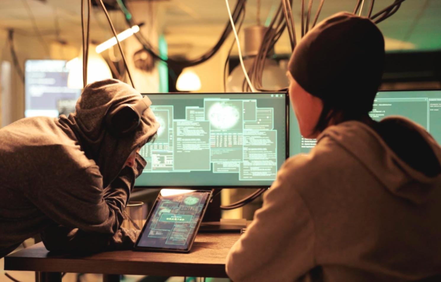 Design students collaborating on interface wireframes during practical workshop session