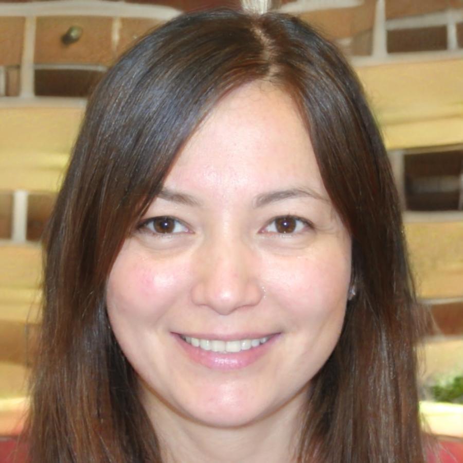 Rhiannon Dugdale reviewing design work at her desk